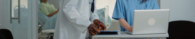 woman-working-as-nurse-using-laptop-to-help-doctor-2022-07-056-13-41-35-utc