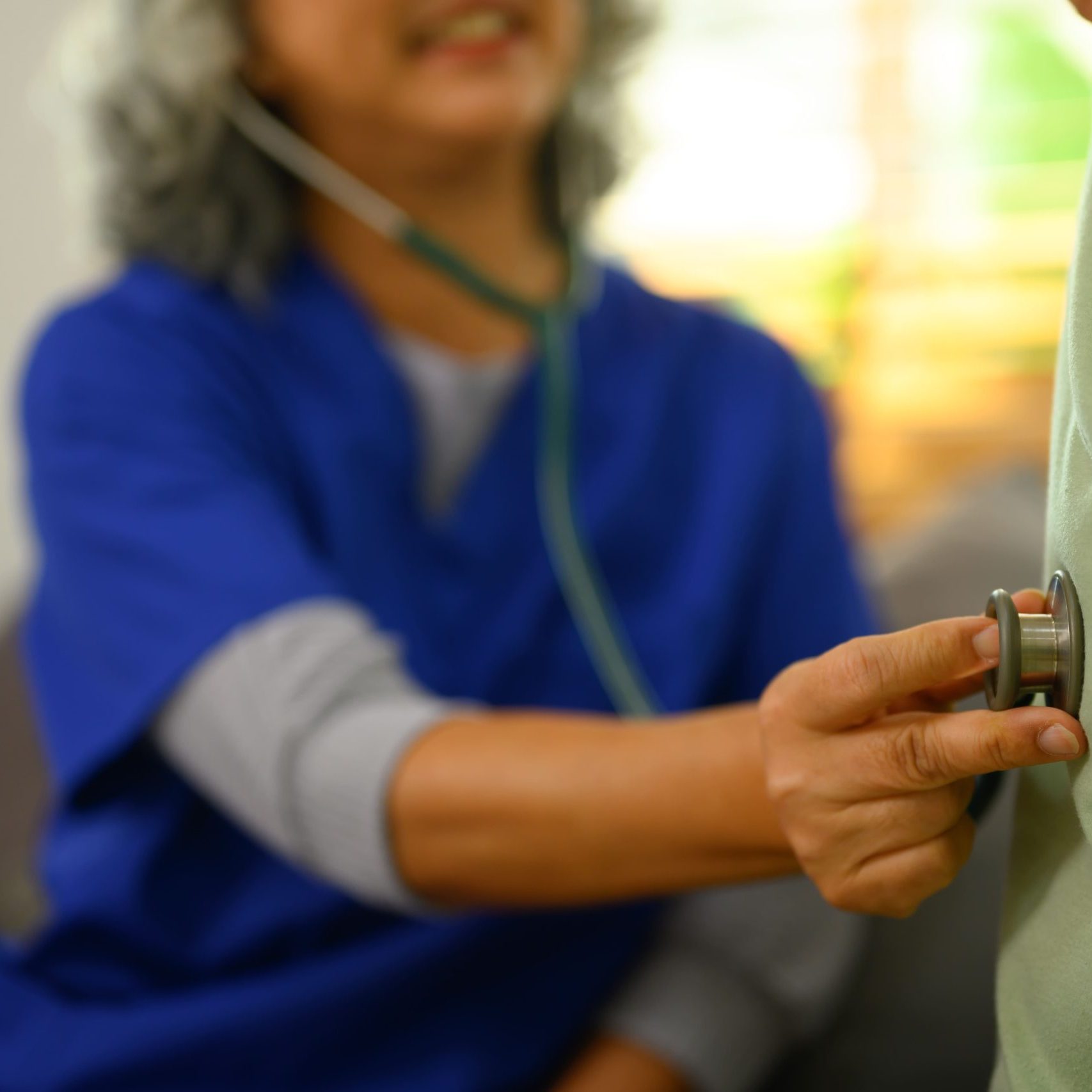 Nurse checking up on patient. Early deterioration detection in aged care