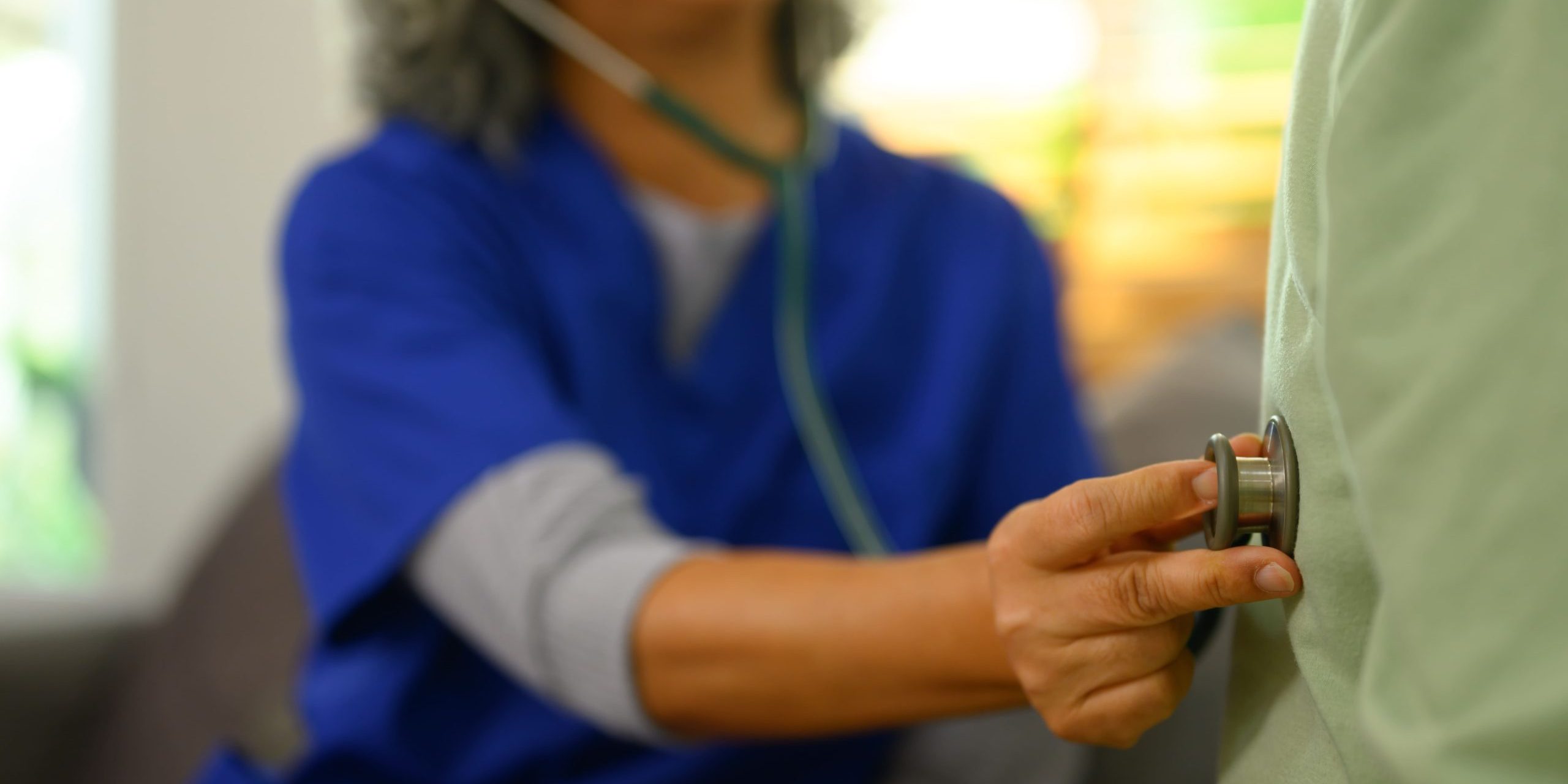 Nurse checking up on patient. Early deterioration detection in aged care